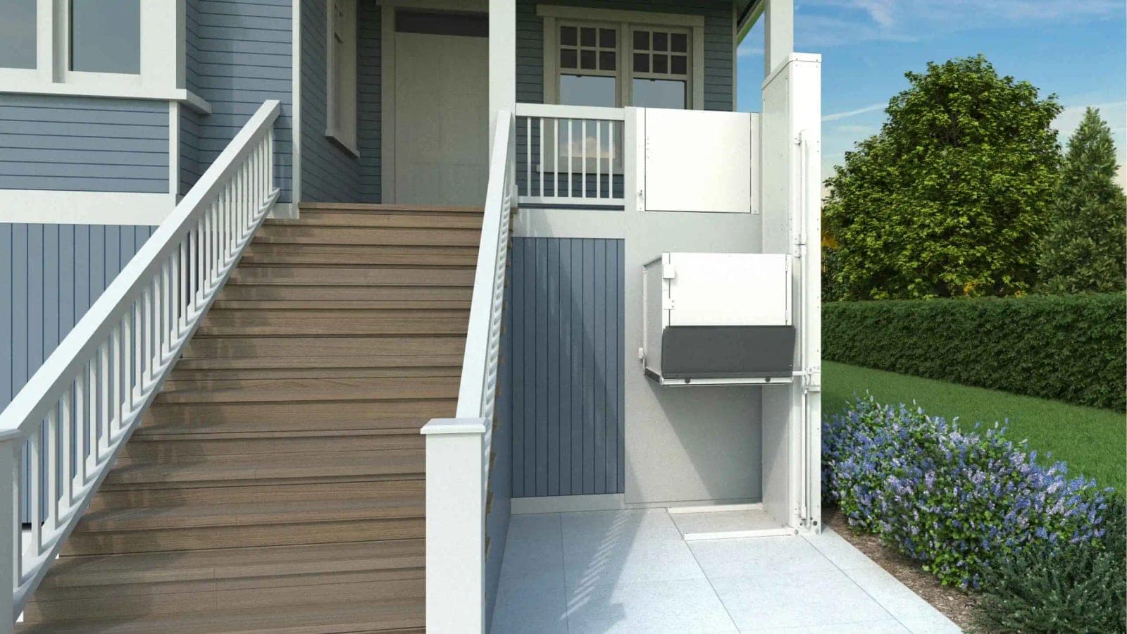 Bruno rendering of a VPL-3100 or VPL-3200 series vertical platform lift beside the front steps of a house. The white tower stands on the right, the unenclosed platform is partway up between the paved lower landing and the porch, and the upper landing gate is set in the porch railing.